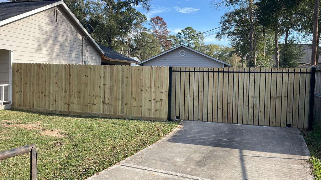 New wood privacy fence and matching driveway gate
